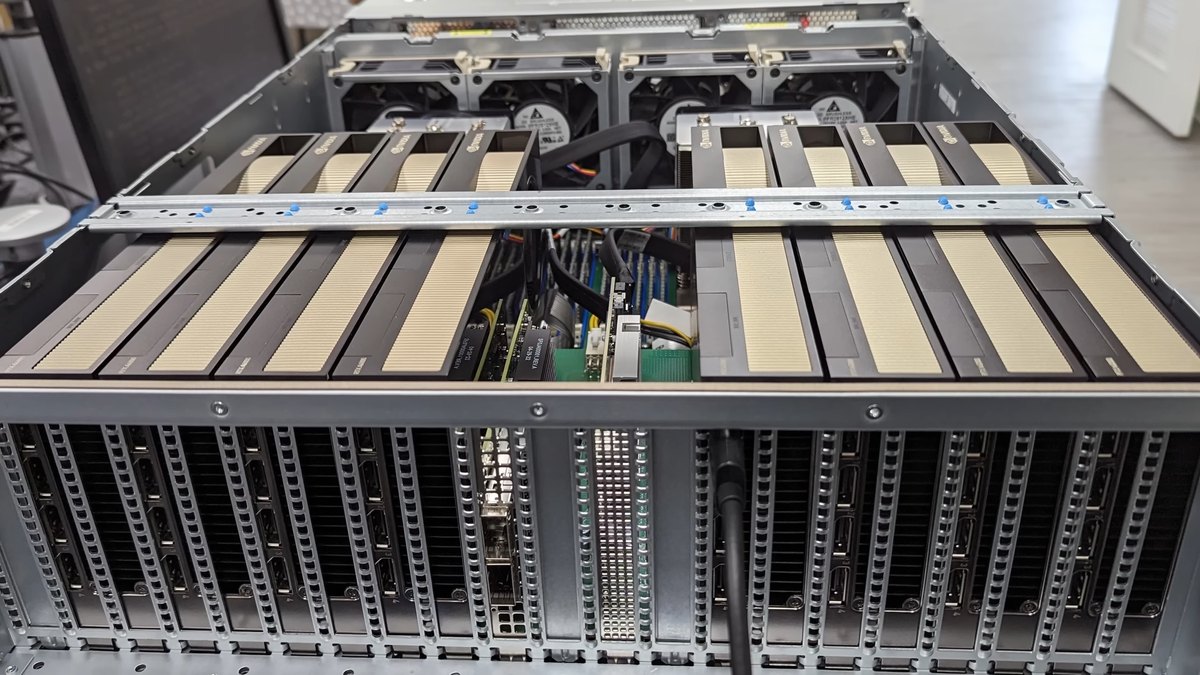 The inside of a server chassis with several NVIDIA GPU cards installed side by side