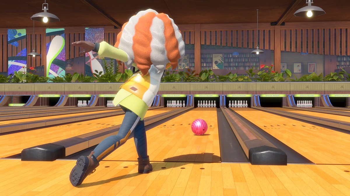 A character releasing a pink bowling ball down a lane in Nintendo Switch Sports Resort