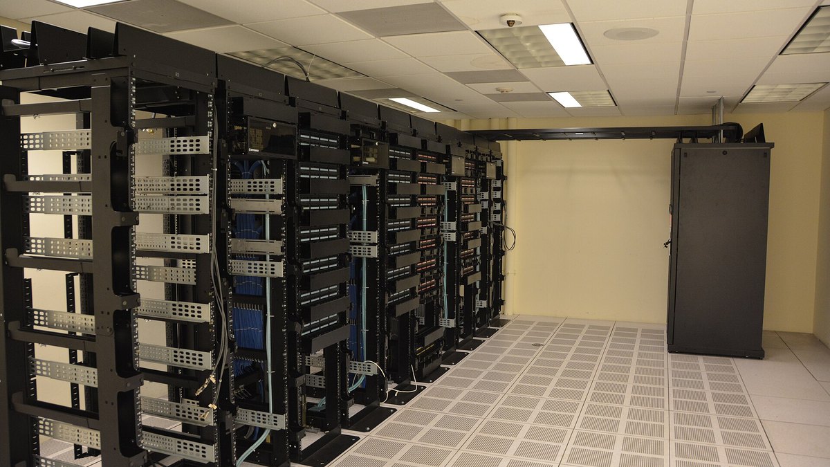 Rows of server racks inside a data center