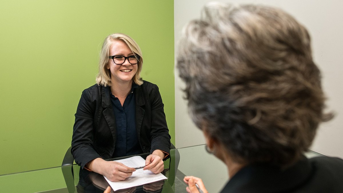 An executive job interview in a small meeting room