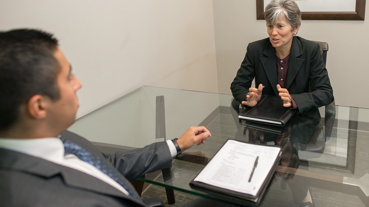 An interviewer speaking with a candidate