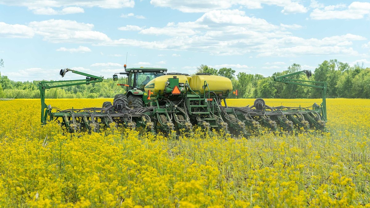 A tractor pulling a no-till planter through a field in Indiana