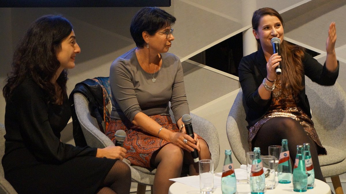 Three translators speaking on a panel at the Frankfurt Book Fair