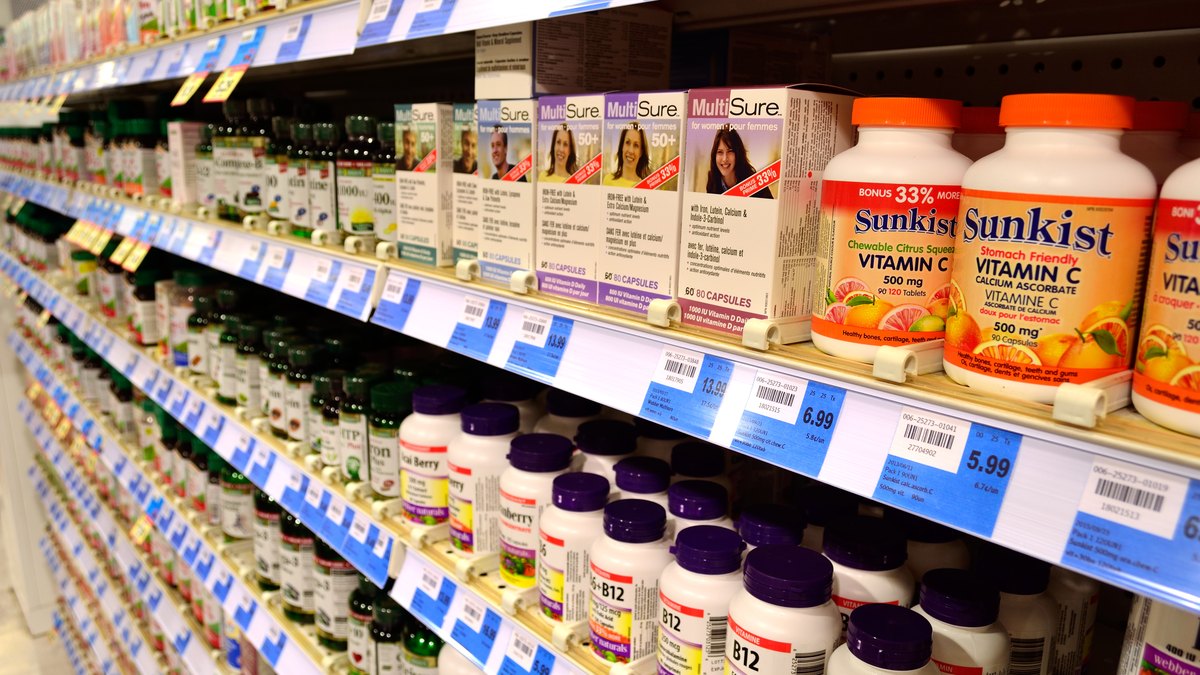 Vitamin supplement pills and capsules on a table